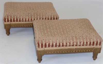 Lot 1220 - A Pair of 19th Century Giltwood Footstools, the rectangular tops upholstered in peach and gold...