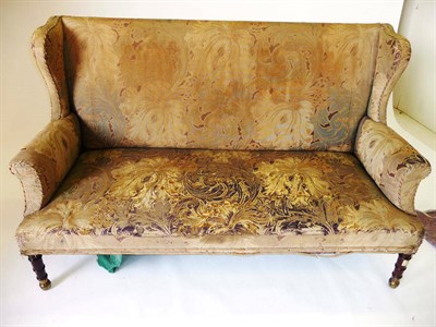 Lot 1223 - A 19th Century Settee, covered in faded floral tapestry, the rectangular back between curved...