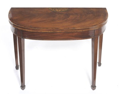 Lot 1231 - A George III Mahogany, Satinwood and Crossbanded Card Table, the demi-lune foldover top inlaid with