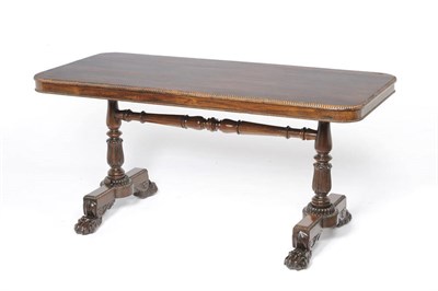 Lot 1234 - A Rosewood Writing Table in the manner of Gillows, late 19th century , the rectangular round...