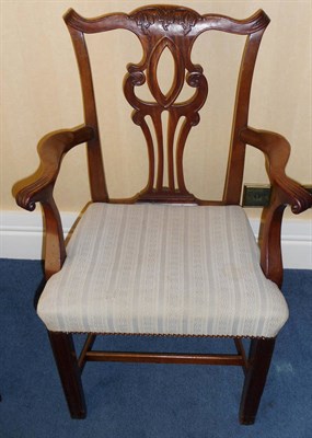 Lot 1250 - A Set of Eight George III Mahogany Dining Chairs, the yoked top rails with acanthus carving and...