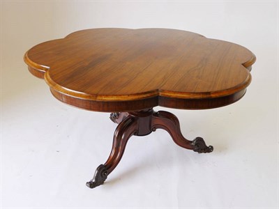 Lot 1257 - A Victorian Rosewood Loo Table, the circular, six-lobed top on a gadrooned baluster and three...