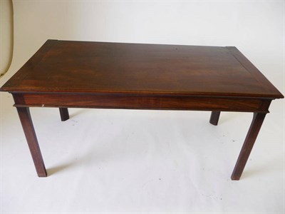 Lot 1270 - A George III Mahogany Side Table, the mitre-cleated top with a moulded edge over a plain,...