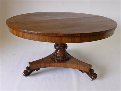 Lot 1275 - A George IV Rosewood Loo Table, the circular top on a leaf-carved baluster with lotus carved...