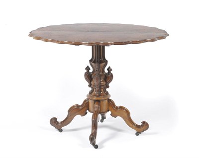 Lot 1278 - A Victorian Walnut Occasional Table, the shaped oval top quarter veneered, on a moulded and...