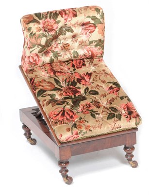 Lot 1280 - A Victorian Walnut Gout Stool, the top upholstered in deep-buttoned floral fabric, on an adjustable