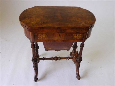 Lot 1281 - A Victorian Walnut and Inlaid Work and Games Table, the shaped rectangular folding top inlaid...