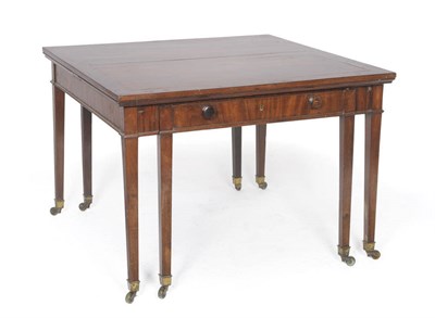 Lot 1288 - A George III Mahogany "Universal Table", after a design by Thomas Sheraton, the square top with two