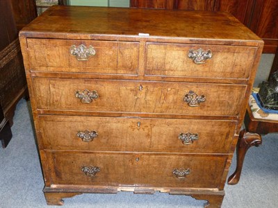 Lot 1294 - A George II Walnut Chest of Drawers, the crossbanded caddy top over two short and three long...