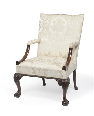 Lot 1300 - A George III Mahogany "Gainsborough" Armchair, the slightly arched top with padded downswept...