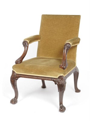 Lot 1302 - A Mahogany "Gainsborough" Armchair, late 19th century, the square back with padded and leaf...