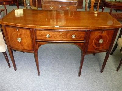 Lot 1311 - A George III Mahogany, Satinwood and Boxwood Strung Bowfront Sideboard, the rectangular crossbanded