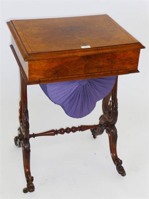 Lot 1315 - A Victorian Walnut Sewing Table, the crossbanded and strung rectangular top revealing a fitted...