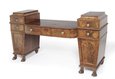 Lot 1321 - A Regency Mahogany Pedestal Sideboard, the bowed centre with a gadrooned edge over three frieze...