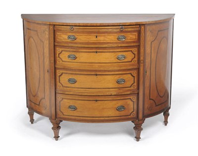 Lot 1329 - A Satinwood, Tulipwood and Rosewood Demi-Lune Commode, the crossbanded top with a interlocking...