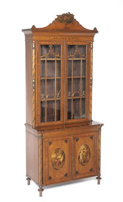 Lot 1330 - An Edwardian Satinwood and Painted Bookcase, the upper section with a relief carved pediment of...