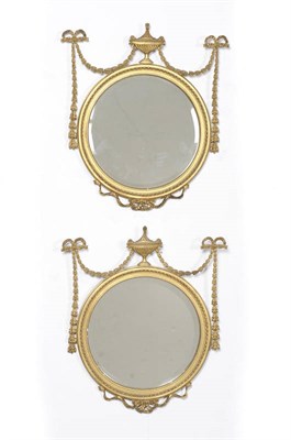 Lot 1289A - A Pair of Gilt and Gesso Wall Mirrors, mid 19th century, the circular plates within a beaded...