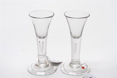 Lot 8 - A Pair of Wine Glasses, circa 1750, each with drawn trumpet bowl and plain teared stem, folded...