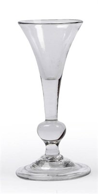 Lot 17 - A Miniature Wine Glass, circa 1740, the drawn trumpet bowl on a plain stem dissected by a...