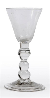 Lot 21 - A Miniature Wine Glass, circa 1730, the funnel bowl on a triple annulated knop and inverted...