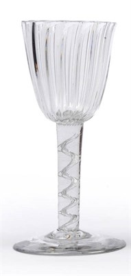 Lot 22 - An Air Twist Wine Glass, circa 1765, the round funnel bowl moulded with vertical ribs, upon a cable