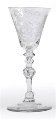 Lot 35 - A Newcastle Light Baluster Wine Glass, circa 1755, Dutch engraved with a coat of arms, reputed...