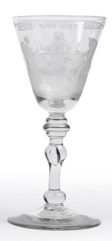 Lot 38 - A Newcastle Light Baluster Wine Glass, circa 1755, Dutch engraved with a family group of four...
