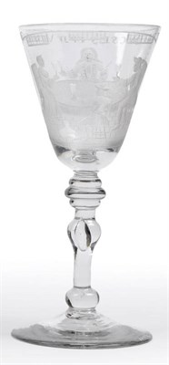 Lot 38 - A Newcastle Light Baluster Wine Glass, circa 1755, Dutch engraved with a family group of four...
