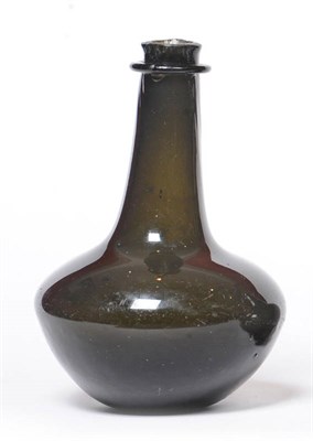 Lot 40 - An English Half-Size "Shaft and Globe" Bottle, circa 1670-80, deep green metal, 18cm high