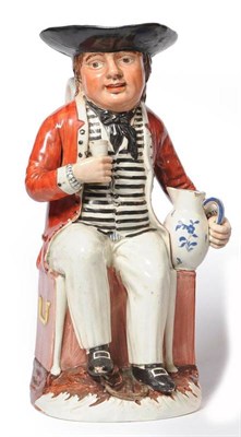 Lot 105 - A Pearlware Pottery Sailor Toby, circa 1800, the young salt seated in a chair over travelling...