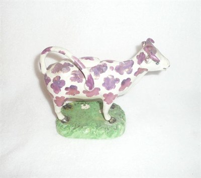 Lot 113 - An English Pearlware Pottery and Copper Lustre Cow Creamer, early 19th century, of typical standing