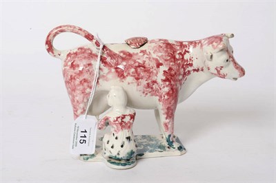 Lot 115 - An English Pearlware Pottery Cow Creamer, early 19th century, the standing cow's backswept tail...