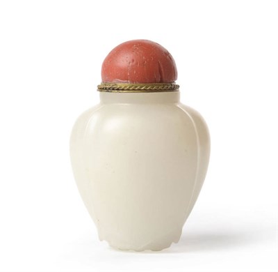 Lot 169 - A White Jade Snuff Bottle, 19th century, in the form of a closed lotus flower, red glass...