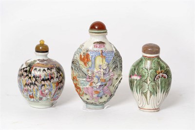 Lot 173 - A Famille Rose Porcelain Snuff Bottle, circa 1850, of flattened ovoid shape, moulded in relief with