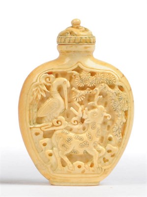 Lot 178 - A Carved Ivory Snuff Bottle, 19th century, of spade form, carved in relief on one side with a...