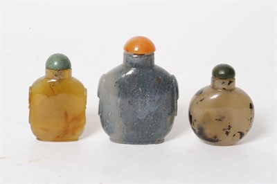 Lot 180 - An Agate Snuff Bottle, circa 1780-1850, of flattened spherical form, with dark inclusions, jade...