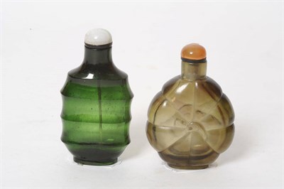 Lot 182 - A Glass Snuff Bottle, 19th/20th century, of flattened melon form centred by a floret, imitating...