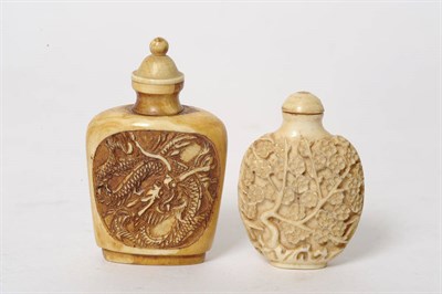 Lot 197 - A Carved Ivory Snuff Bottle, probably 19th century, of spade form, carved in high relief on one...