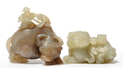 Lot 206 - A Chinese Jade Carving of a Boy and Monkey on a Water Buffalo, Qing Dynasty, 18th/19th century, the