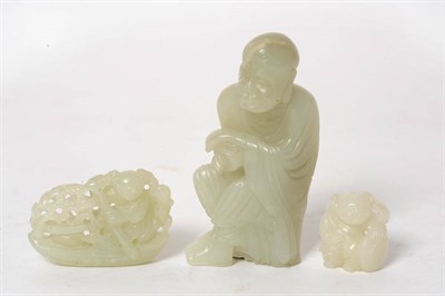 Lot 207 - A Group of Three Chinese Jades, 19th/early 20th century, comprising kneeling lohan, of pale celadon