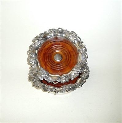 Lot 220 - A Pair of Sheffield Plate Bottle Coasters, circa 1850, with everted fruiting vine cast rims,...