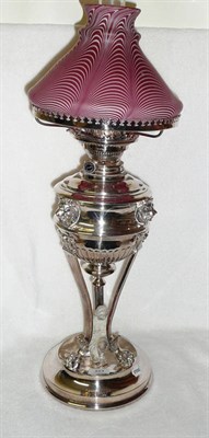 Lot 223 - A Late Victorian Silver Plated Table Oil Lamp, circa 1890, with combed red and white conical...