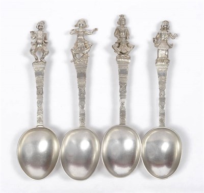 Lot 226 - A Set of Four Silver Burmese Spoons, circa 1880, each with plain oval bowls, chased mask and...