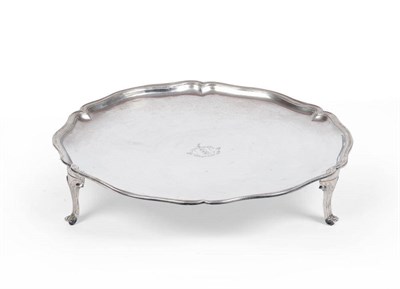 Lot 233 - A Portuguese Silver Salver, Lisbon, circa 1770, shaped circular with waved rim, raised on three...