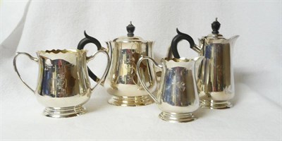 Lot 239 - A George V Four Piece Teaset, maker's mark HTH&Co,  Birmingham 1920, each piece with bracket...