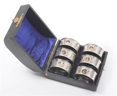 Lot 247 - A Set of Six Edward VII Napkin Rings, maker's mark HE, Birmingham 1904, circular with applied...