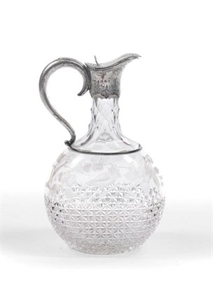 Lot 259 - A Victorian Claret Jug, Henry Welfare & Co, Birmingham 1881, the clear glass body of flat sided...