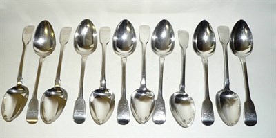 Lot 270 - A Composite Set of Twelve Fiddle Pattern Tablespoons, London 1819 and 1832, each with dolphin crest