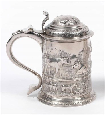 Lot 294 - A George II Tankard, William Atkinson, London 1727, the girdled cylindrical body later chased...