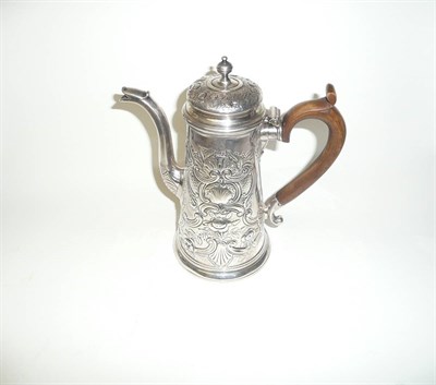 Lot 298 - A George I Coffee Pot, London 1724, of tapering cylindrical form with wood scroll handle, domed...